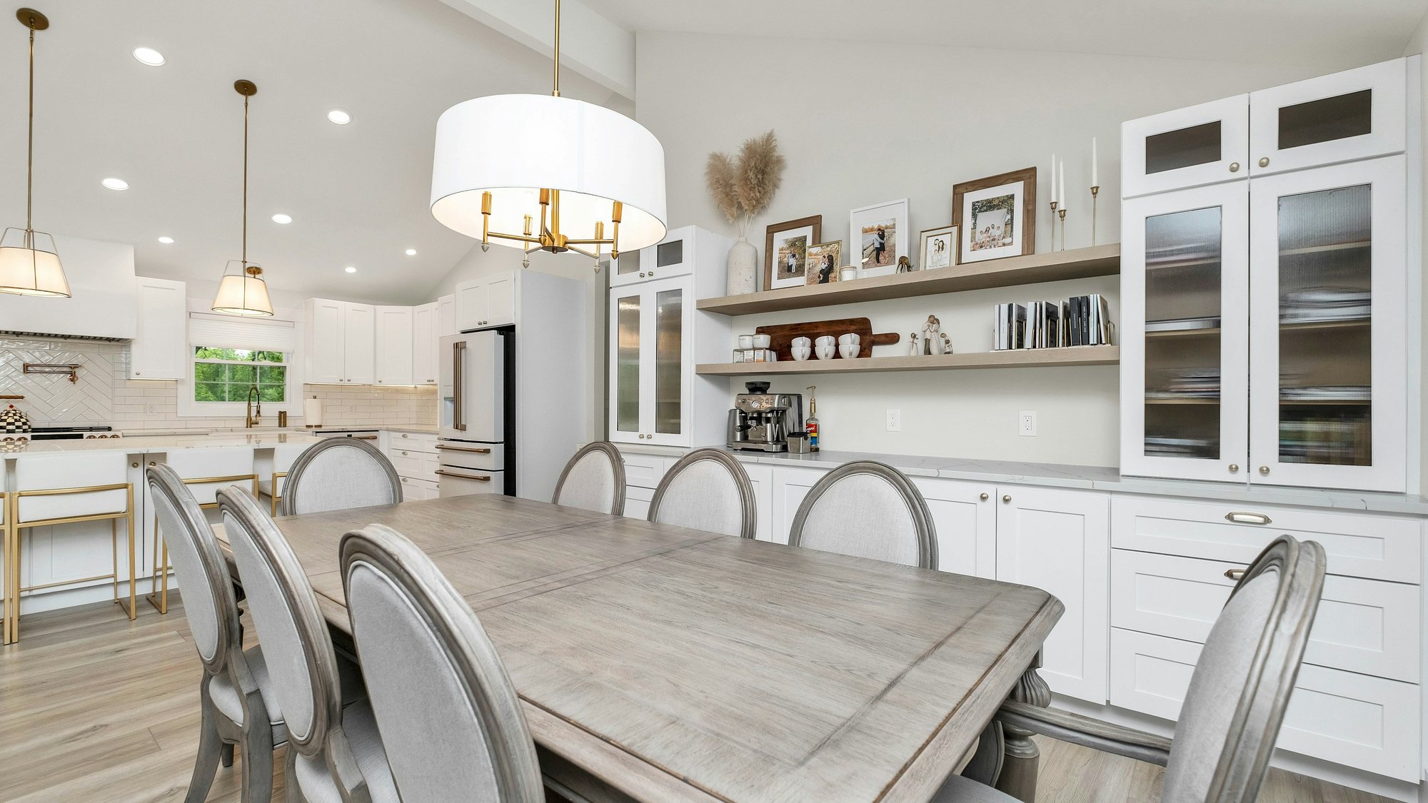 A bright kitchen with a dining table and chairs
