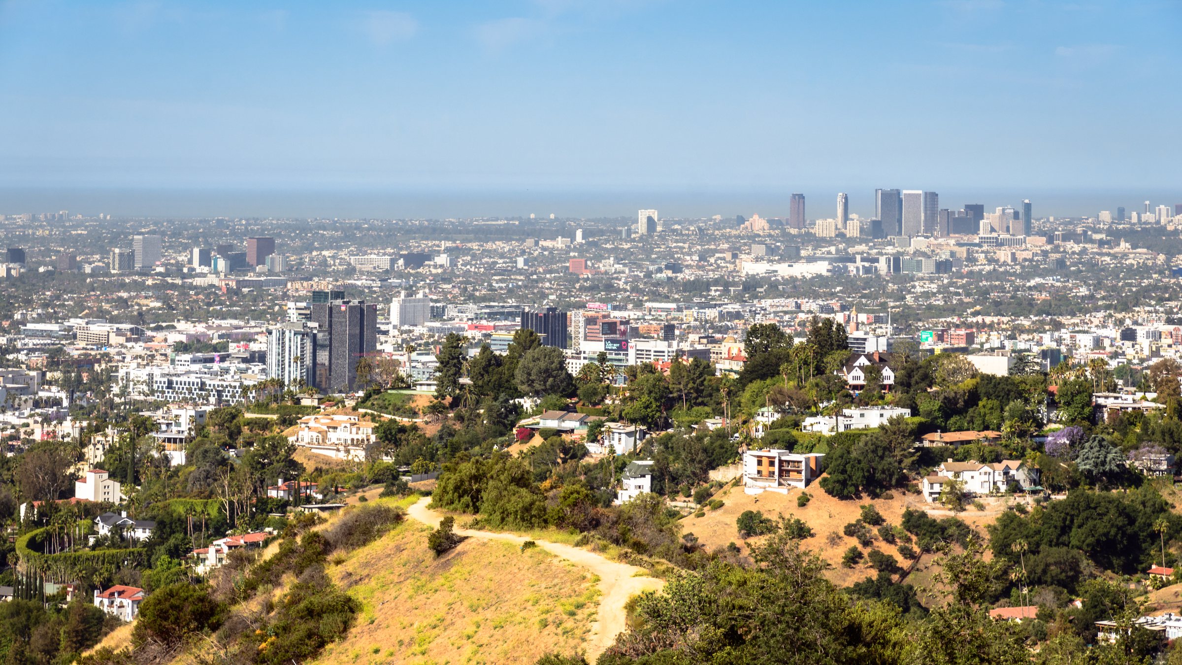 Hillside homes above Los Angeles, with the city spreading to the horizon