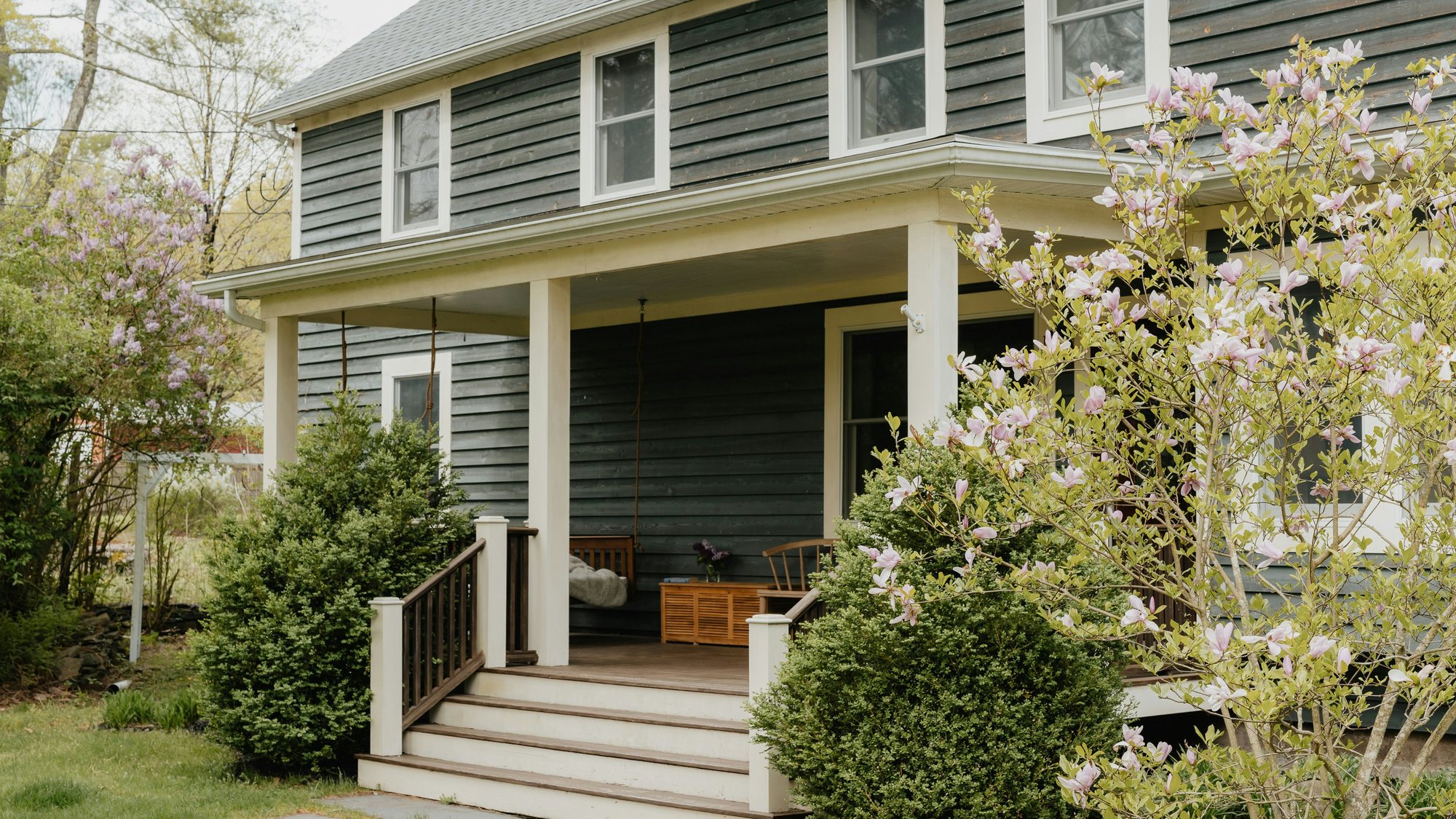 A house with a covered porch and front steps