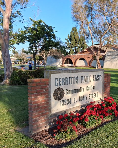 The sign and lawn at Cerritos Park East