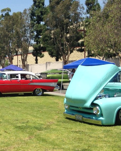 Classic cars on the grass at a car show in Stanton